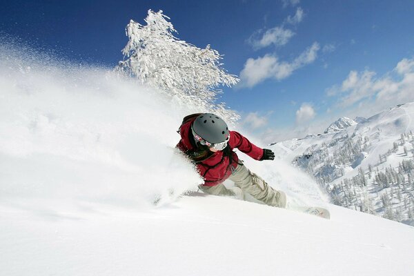 The girl is experiencing adrenaline. Snowboarding downhill