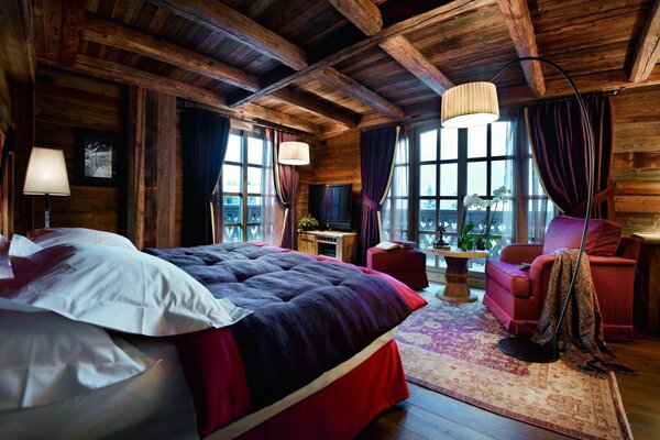 Cozy bedroom with wooden ceilings