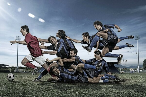 Équipe de football sur le terrain avec le ballon