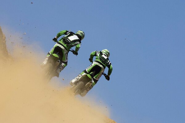 Two rival motorcyclists at the races