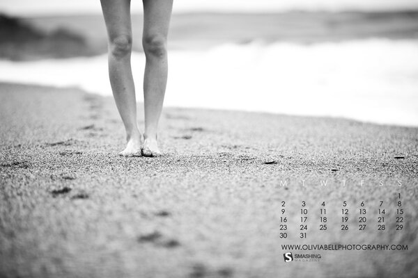 Bare legs against the background of the sea