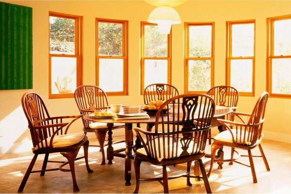 Design of the dining room in the villa with a wooden table