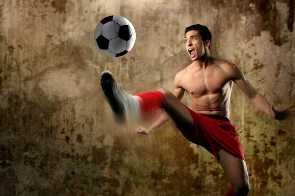 The famous football player hitting the ball