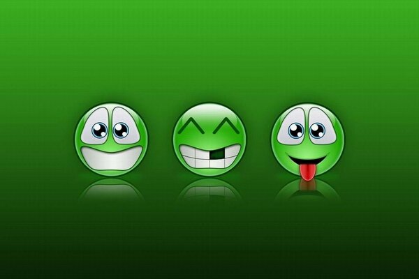 Green three emoticons on a green background