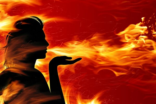 Fille respire la flamme du feu