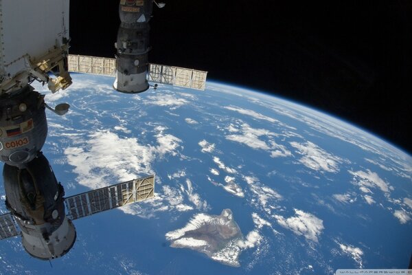 Msk Soyuz in space above the earth and clouds