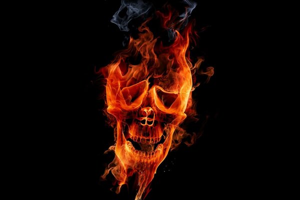 Smiling fiery skull on black