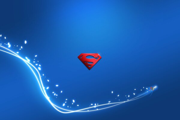 Red Superman logo on a blue background with a white wave