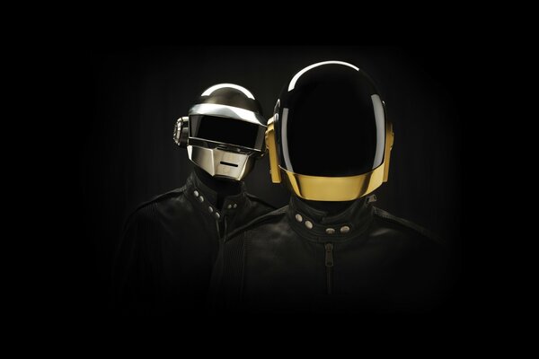 Two men in helmets and leather jackets on a black background