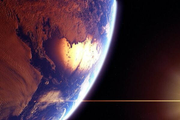 The light of the sun illuminates the earth from space