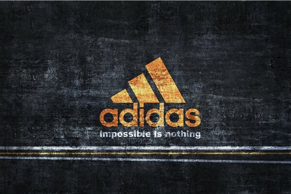 The sign and letters of the Adidas company on a black shabby background