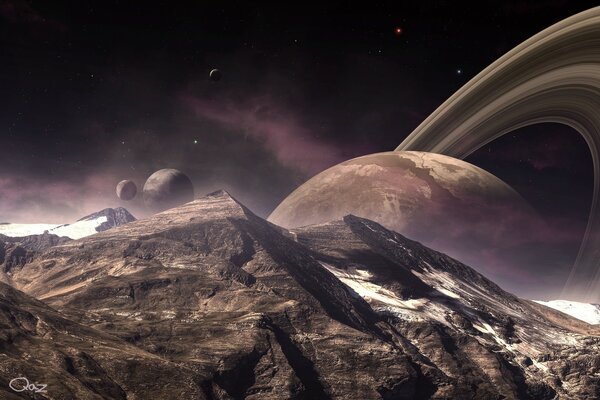 A planet with rings hidden behind a mountain