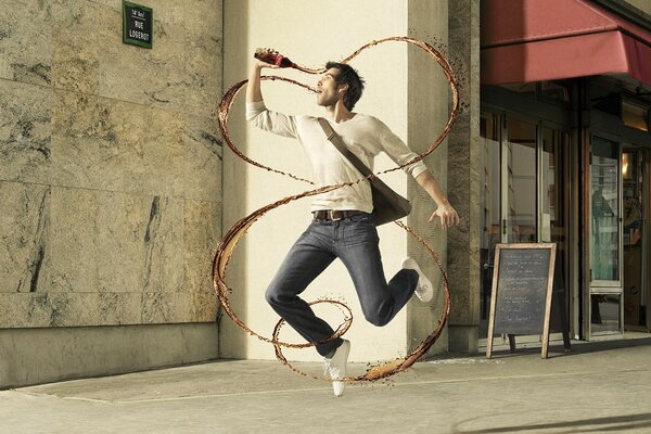 A guy and a jet of Coca Cola. Running with a drink