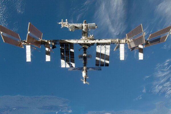 Photo of the ISS against the background of the cosmic sky