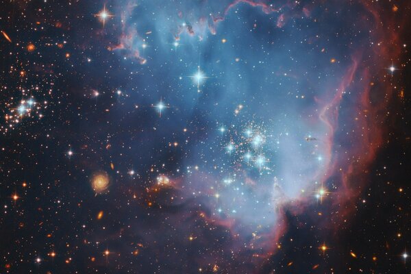 A cluster of stars from the nebula in blue-orange shades