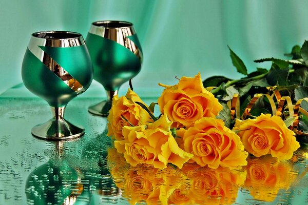 Fushers and pink roses on a wet table