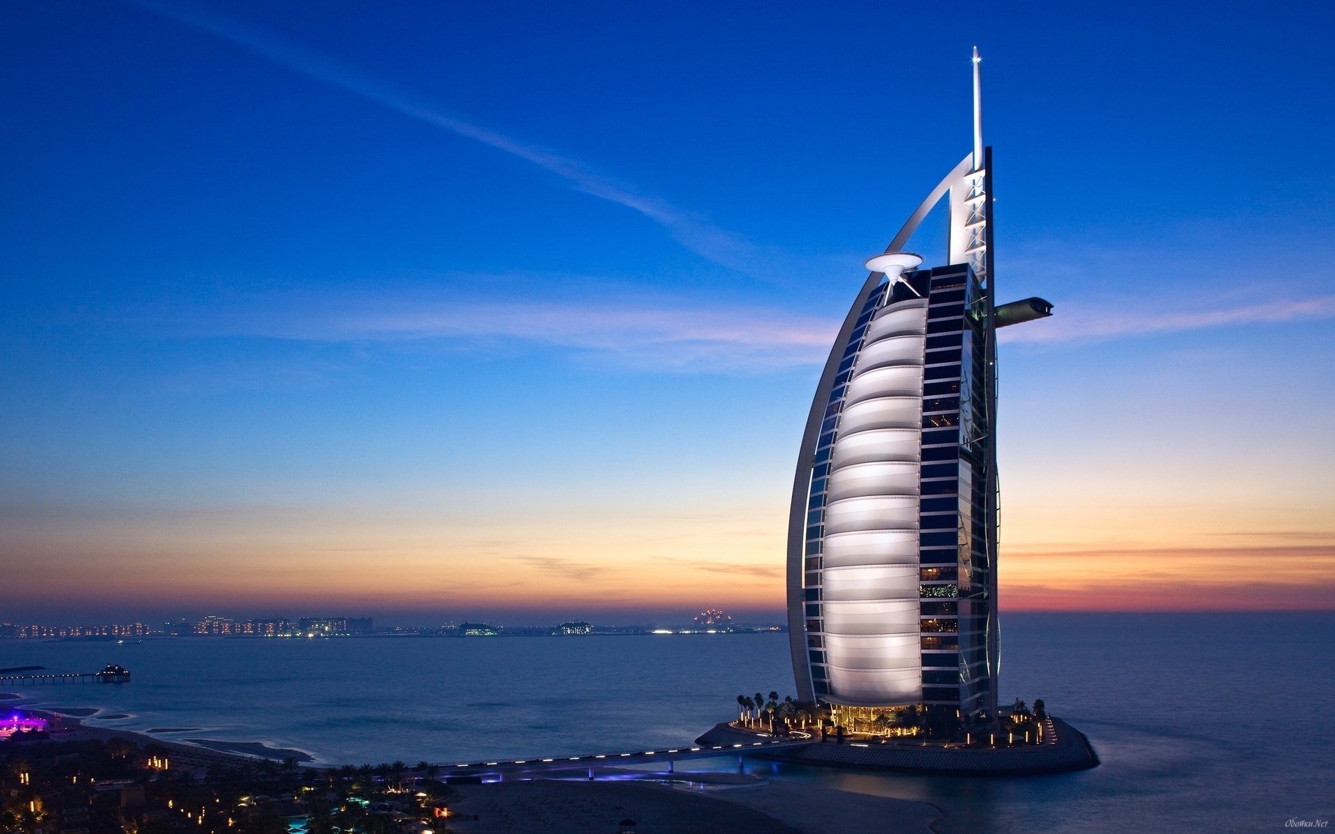 the city dubai the hotel sea the sky the evening