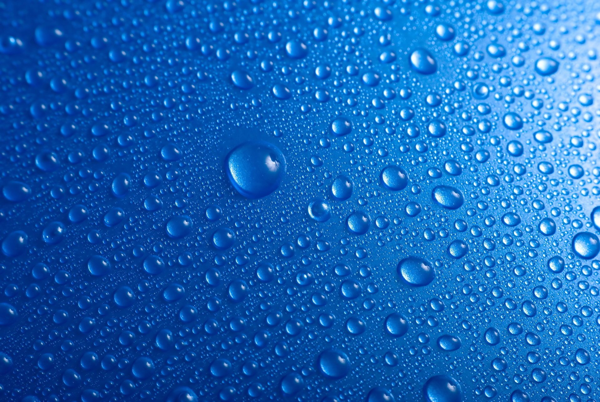 on blue drops water background blue