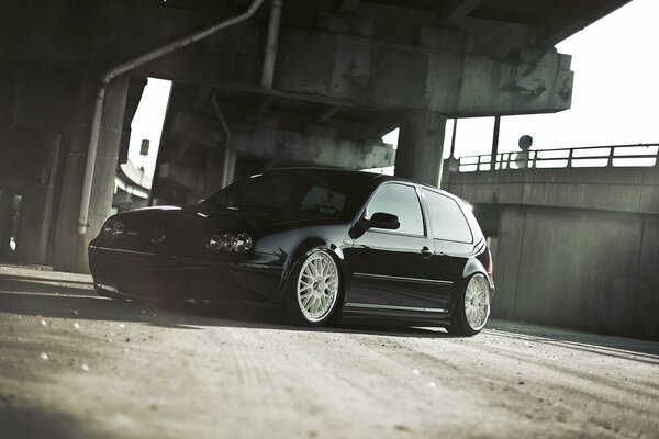 Black volkswagen golf in a non-residential building