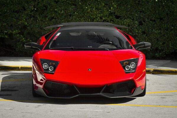 Lamborghini red in the parking lot