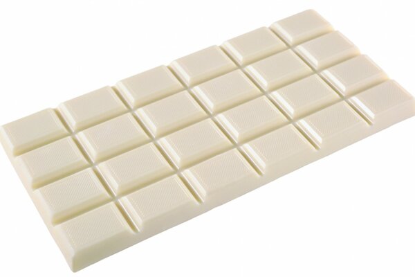 A bar of white chocolate on a white background