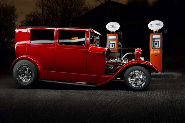 Red Ford car. ford near the gas station