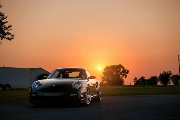 Porsche 911 on the background of nature and sunset