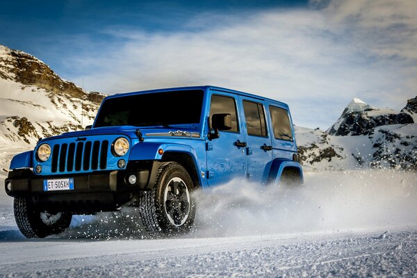 Jeep wrangler polar rides on a snowy road