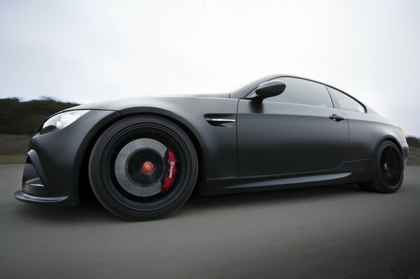 Matte black BMW m3, e92, at speed