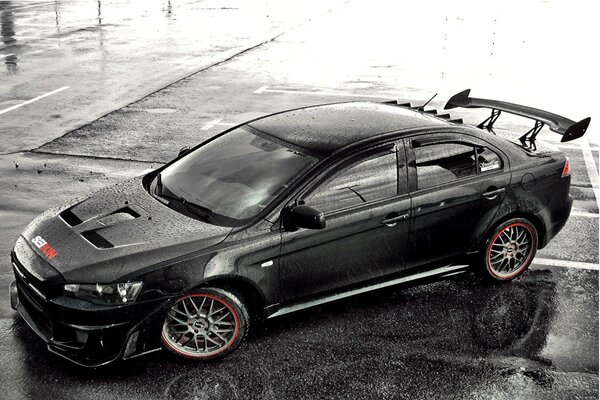 Mitsubishi lancer coche negro lluvia