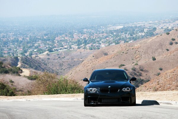 Black bmw, 335i with a beautiful view