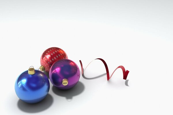 Three Christmas balls and streamers