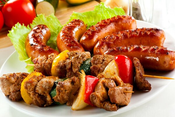 Delicious fried sausages and shish kebab