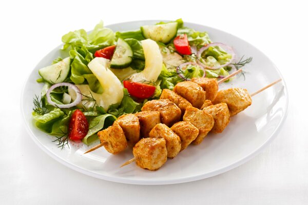 An example of a beautiful serving of kebabs with salad