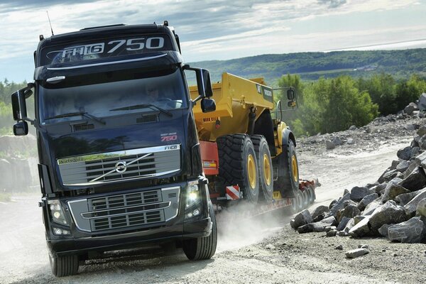 A cargo tractor is driving along the highway