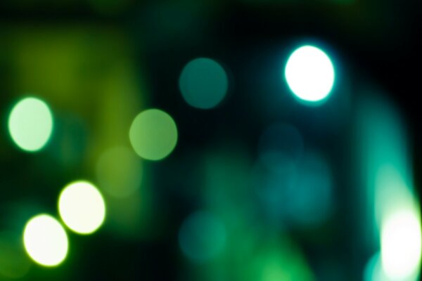 The sparkle of lights on a green background