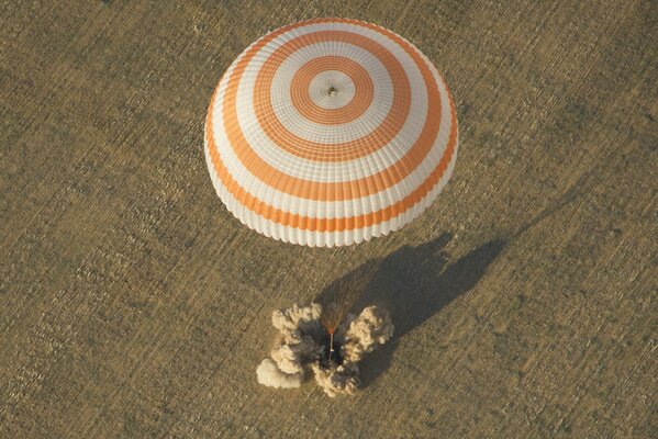 Parachute drop on the field. Landing on the field