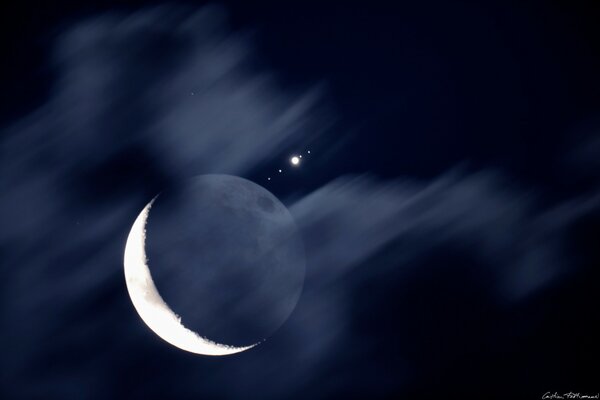 Moon and star in the blue sky at night