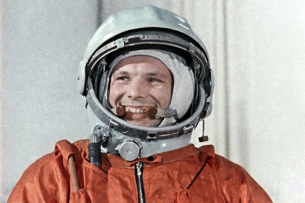 Photo of Yuri Gagarin in a red cosmonaut suit