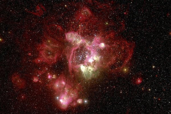 A red nebula against the background of the stars of the universe