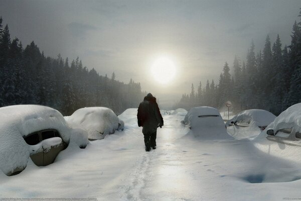 Two people are walking along the road among cars in the snow