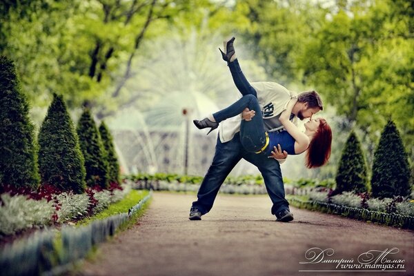 A couple in love on the background of a fountain