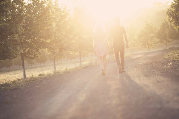 The couple walks hand in hand