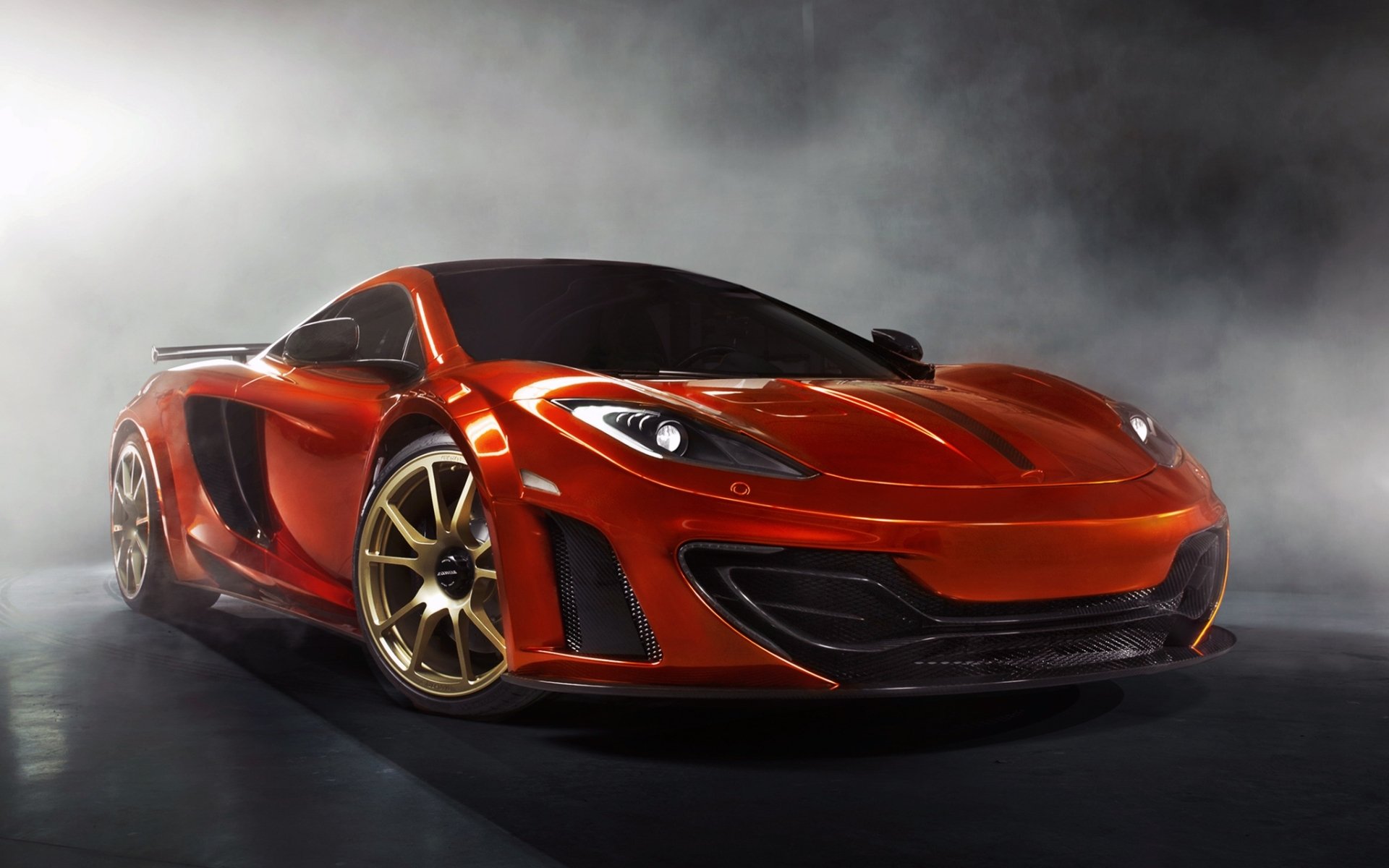 mansory mclaren mp4-12c mclaren supercar pomarańczowy przód tuning dym tło