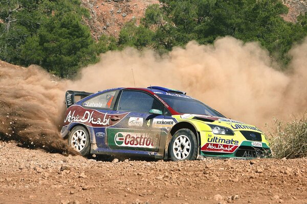 Ford skidding into a turn in the desert