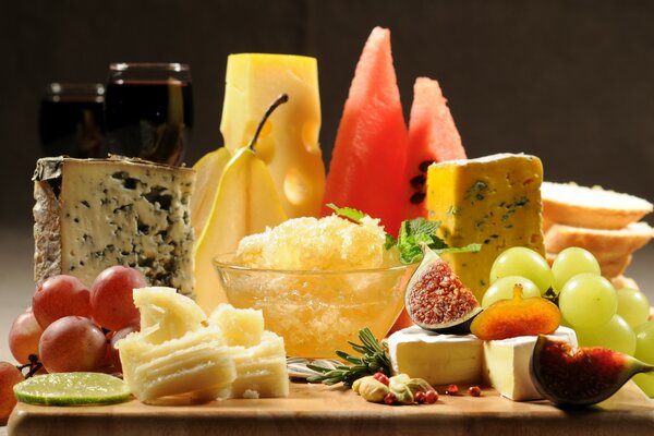 Fruits and cheese with blue mold