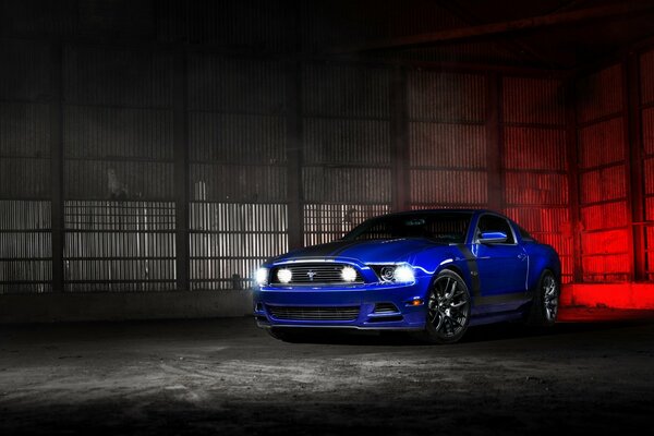 Blue Ford Mustang in the garage