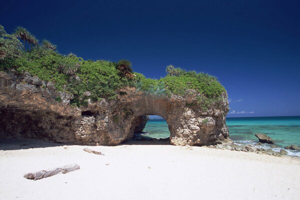 Sea beach with white sand and rocks