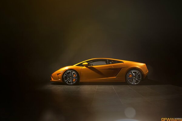 Gold lamborghini lp560 on the wall background