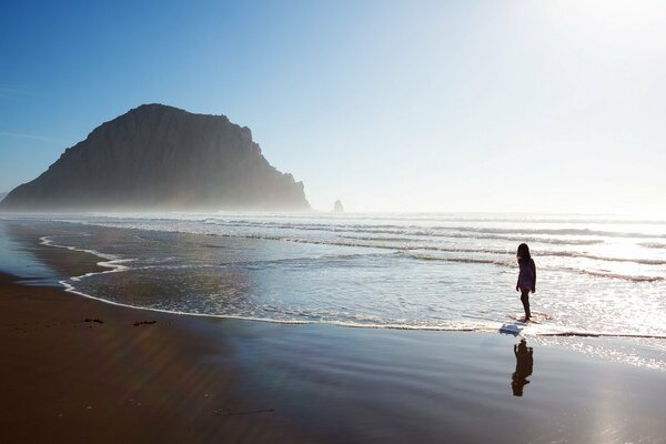 Silhouette of a man on the seashore